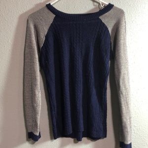 Blue long-sleeve sweater.